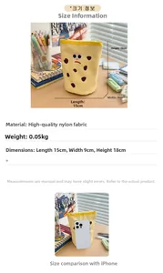 Detail view of yellow nylon pencil pouch with cute cartoon cookie face embroidery