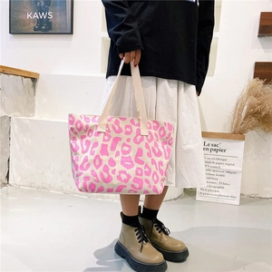 Detailed shot of large capacity pink leopard canvas tote bag with thick webbing handles