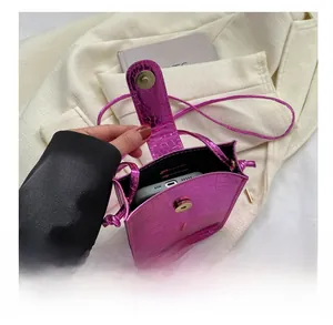 Detail showing the internal capacity of the rose red crocodile pattern mini phone bag
