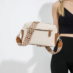 Vintage cream leather crossbody bag with brown trim and geometric pattern wide shoulder strap
