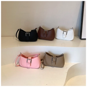 Group display of half-moon underarm bags in five colors with lychee grain texture