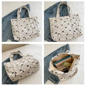Detailed views of quilted corduroy tote bag with bow print and spacious interior