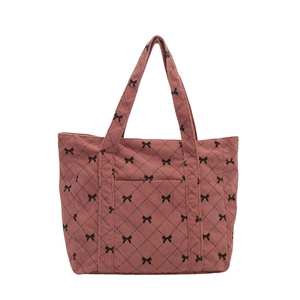 Pink corduroy tote bag with black diamond quilting and bow patterns for women
