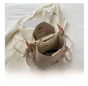 Spacious interior of the cream white bucket bag showing storage for daily essentials