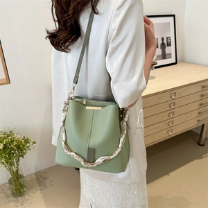 Chic light green bucket bag with silk scarf chain handle and leather strap for women