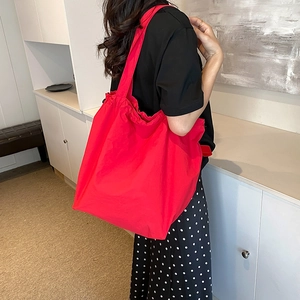 Minimalist red nylon bucket shoulder bag with pleats for women's daily commute