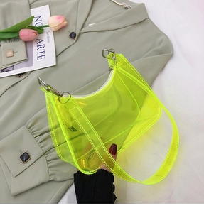 Detailed close-up of a neon yellow transparent PVC hobo bag with a silver zipper