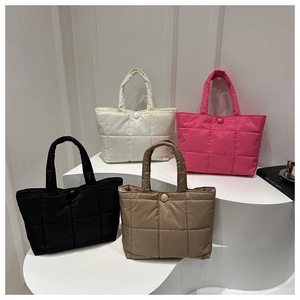 Detailed display of four quilted puffer tote bags in white, pink, black, and khaki colors