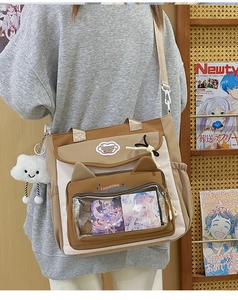 Detail view of the kawaii nylon messenger bag with transparent window and plush cloud charm