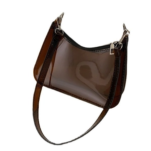 Fashionable smoky brown transparent PVC underarm bag with silver zipper and sleek design