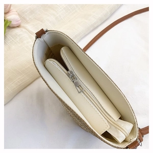 Detail view of woven bucket bag interior with durable lining and secure zipper pocket