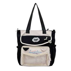 Black and white nylon tote bag with transparent front pocket and cloud-shaped patch