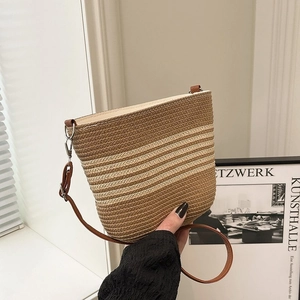 Fashionable striped woven bucket bag with leather strap for casual beach vacation styles