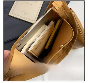 Internal view of the brown leather tote showing spacious capacity and magnetic closure
