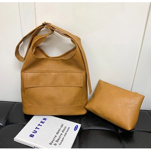 Caramel faux leather tote and pouch set with front flap pocket and adjustable strap