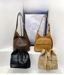 Detailed view of large capacity tote bags in four colors with lychee texture finish