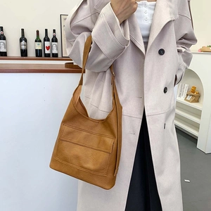 Minimalist brown matte leather tote bag for women showing a stylish large capacity design