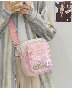 Pink and white canvas itabag detail featuring transparent PVC layer and bunny badges