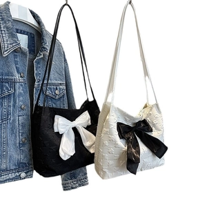 Fashionable tote bag with large bow and star texture embroidery in black and beige colors