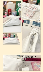 Detailed view of white PU leather ita bag showing clear front window and floral zipper charms