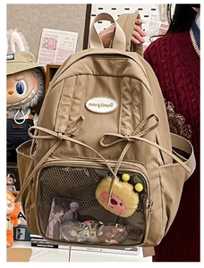 Detail of khaki Japanese Itabag with clear PVC window and decorative ribbon bows