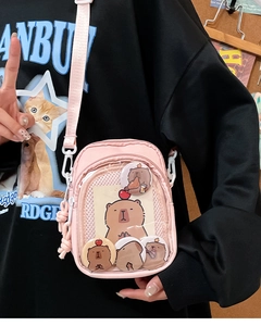 Pink Capybara ita bag with clear PVC window and adjustable strap for shoulder wear