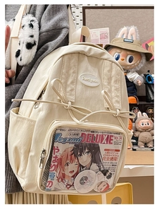 Detail view of Japanese style cream backpack with transparent PVC pocket and bows