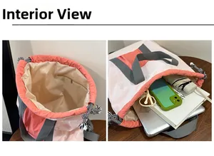 Interior view of large capacity colorblock tote showing inner pocket and daily essentials