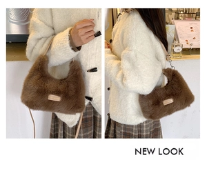 Detail of brown plush shoulder bag showing soft texture and metal love every day plate