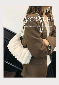 Detailed view of white faux fur shoulder bag with vertical stripe pleated texture