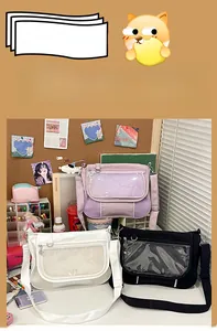 Three Ita bags in pink, white and black with clear PVC display windows for pins and badges