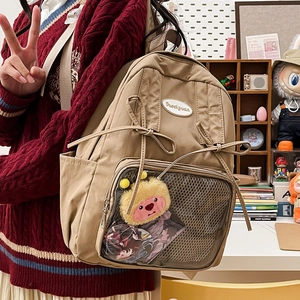 Japanese style khaki canvas backpack with clear pocket and bow detail for students