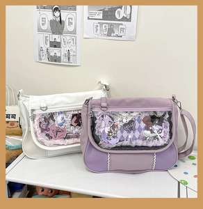 Detail of transparent PVC window with lace trim on white and purple ita bags