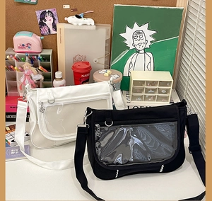 Detailed view of black and white ita bags with large transparent PVC display front pockets