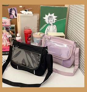 Detail view of transparent ita bag window with side mesh pocket and adjustable strap