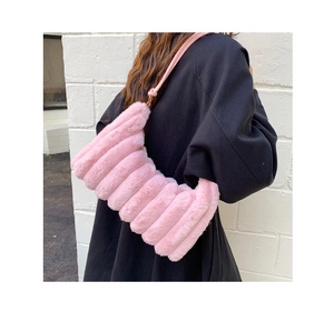 Detailed view of pink plush faux fur shoulder bag with vertical stripe texture and strap