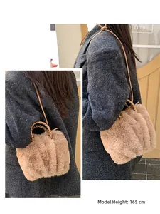Detail of khaki plush cloud bag showing soft faux fur texture and leather strap