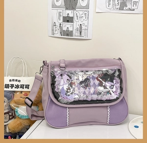 Detail of purple ita bag with clear window, lace trim, and DIY ribbon decorations