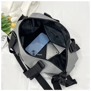 Macro detail of the spacious grey waterproof travel bag with high capacity U-shaped opening