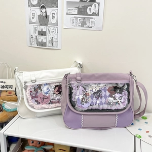 Detail of white and purple Ita-bags with transparent windows and lace decorations