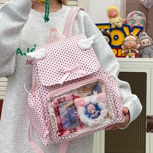 Pink polka dot Ita-bag with transparent PVC window and white plush angel wings