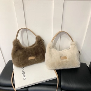 Plush shoulder bag in brown and off-white faux fur with stylish leather straps