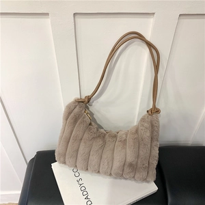 Close-up of plush faux fur texture with vertical stripes and leather strap detail