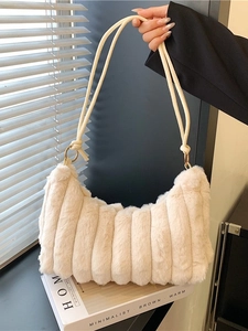 Beige striped faux fur underarm bag with plush texture and minimalist metal hardware