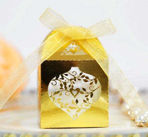 Elegant gold hollow laser-cut heart favor box with yellow ribbon and floral pattern