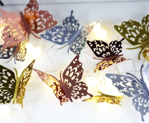 Detail showing 3D hollow butterfly wall stickers with metallic gold and rose gold textures