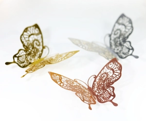 Detailed 3D laser-cut lace butterfly wall stickers in gold, silver, and copper finishes
