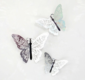 Three assorted 3D hollow butterfly wall stickers in iridescent silver with metallic finish
