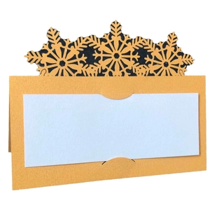 Laser-cut cream snowflake place cards for Christmas weddings and festive table settings