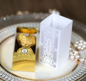 Detailed laser-cut Christmas candy box featuring a gold mirror finish and snowflake patterns